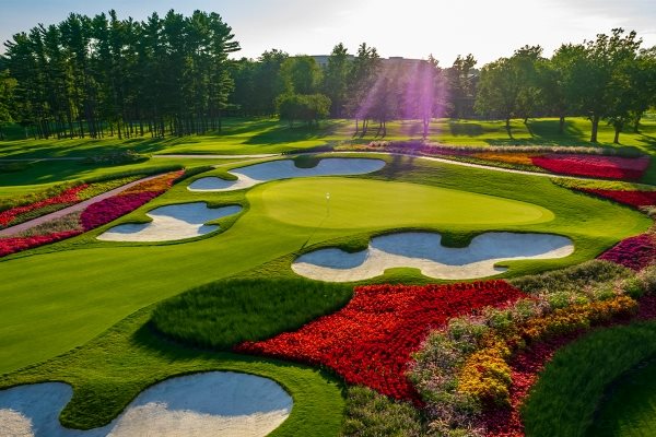 Putting green with surrounding flowerbeds